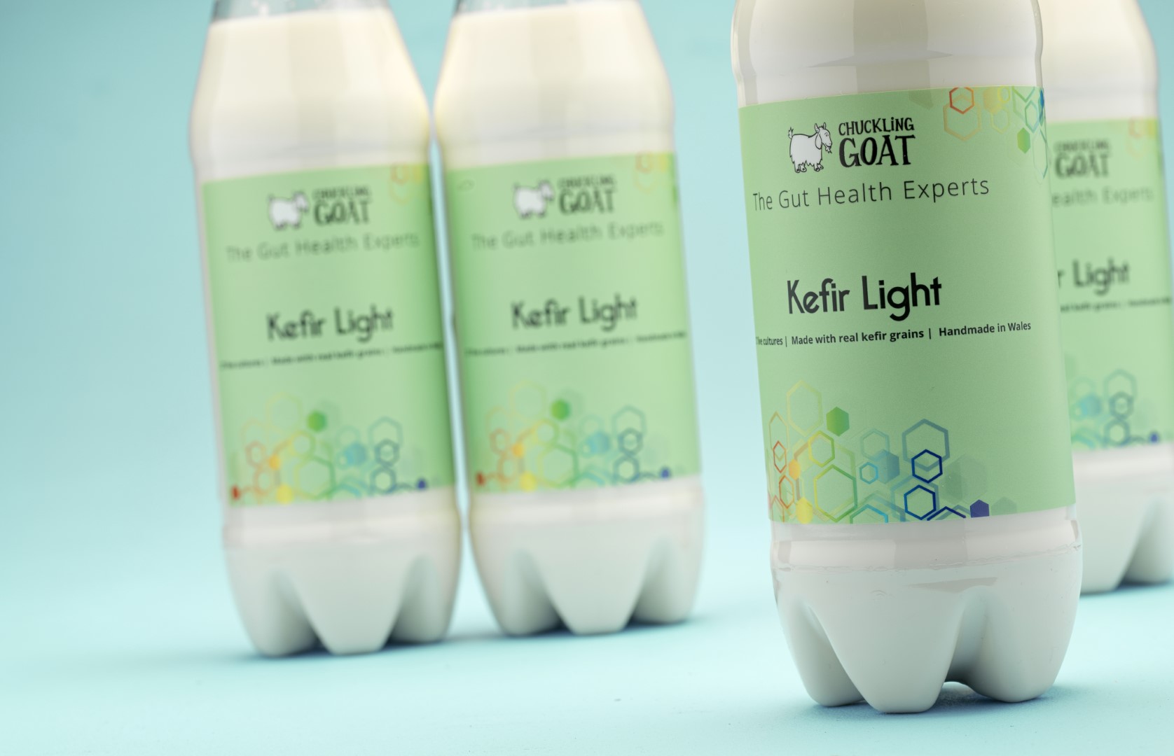 Four bottles of Chuckling Goat Light kefir