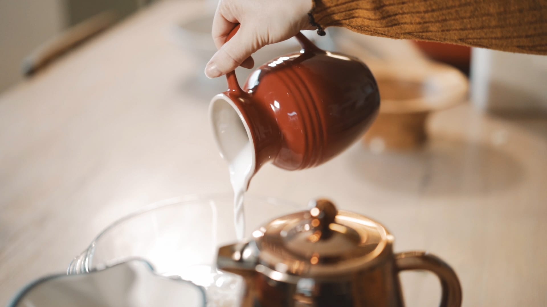 Kefir being poured from a jug