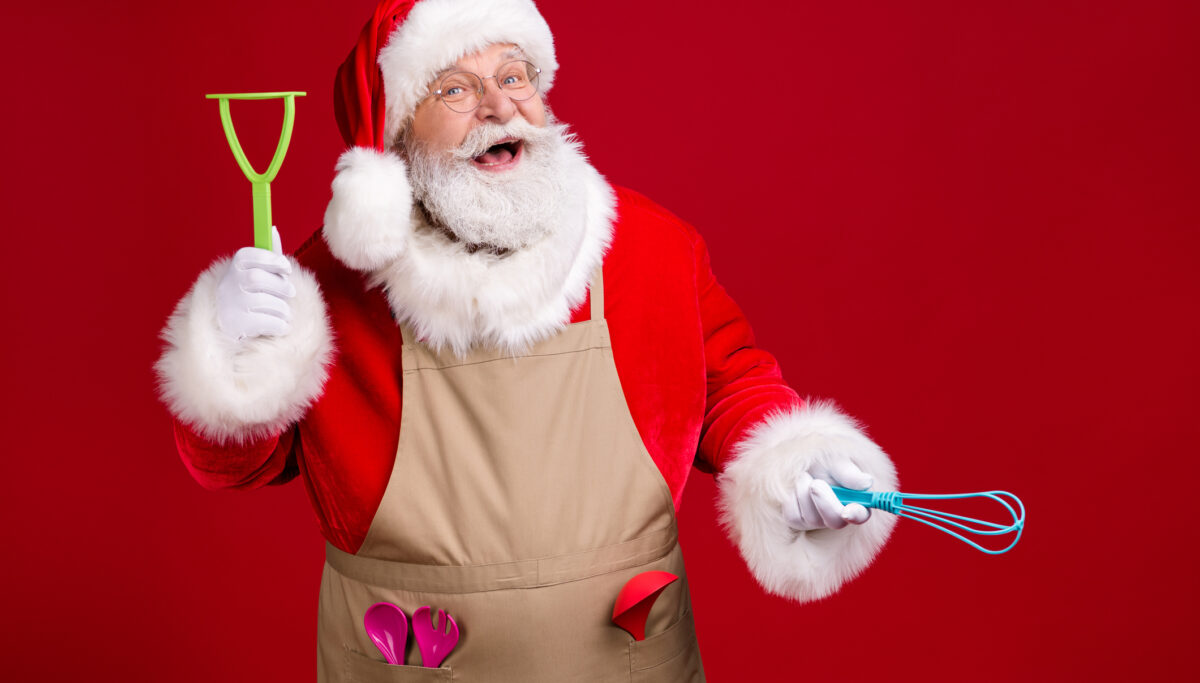 Photo of santa chef santa claus, hold kitchenware x-mas dinner cook wear red costume headwear apron isolated bright shine color background