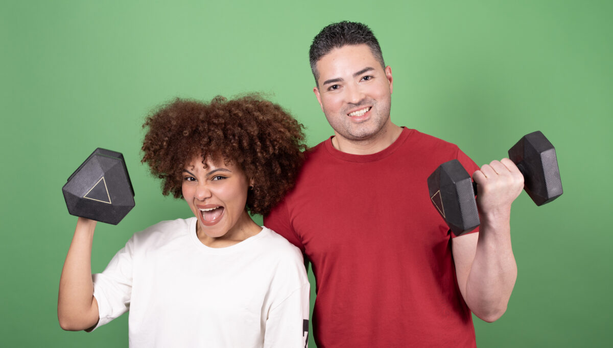 Couple training weights in studio shot for article with ways to exercise without going to the gym.