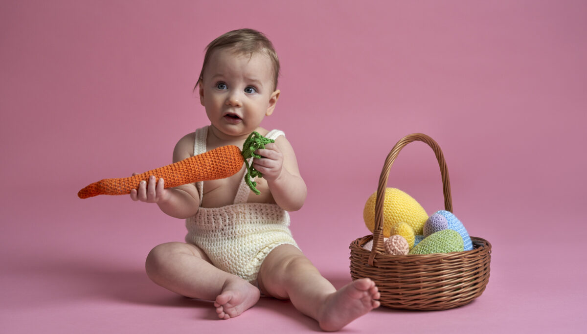 Cute smiling baby with easter decorations