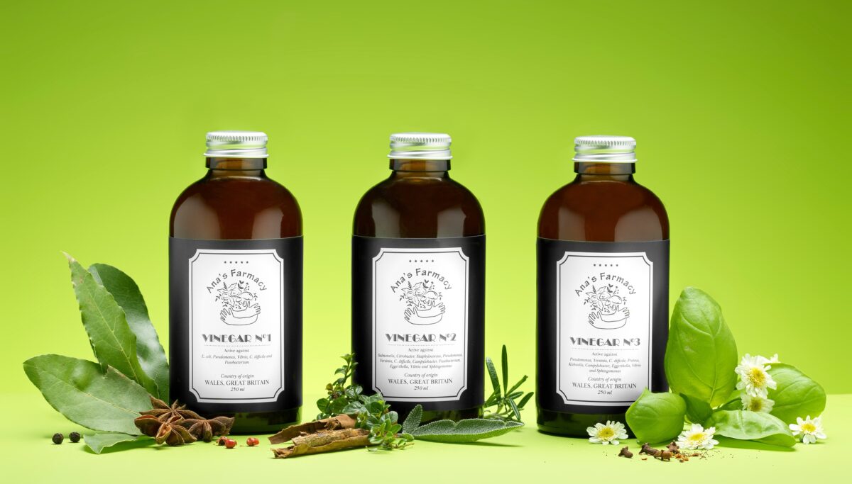 Chuckling Goat's three antimicrobial vinegar products on a green coloured background.