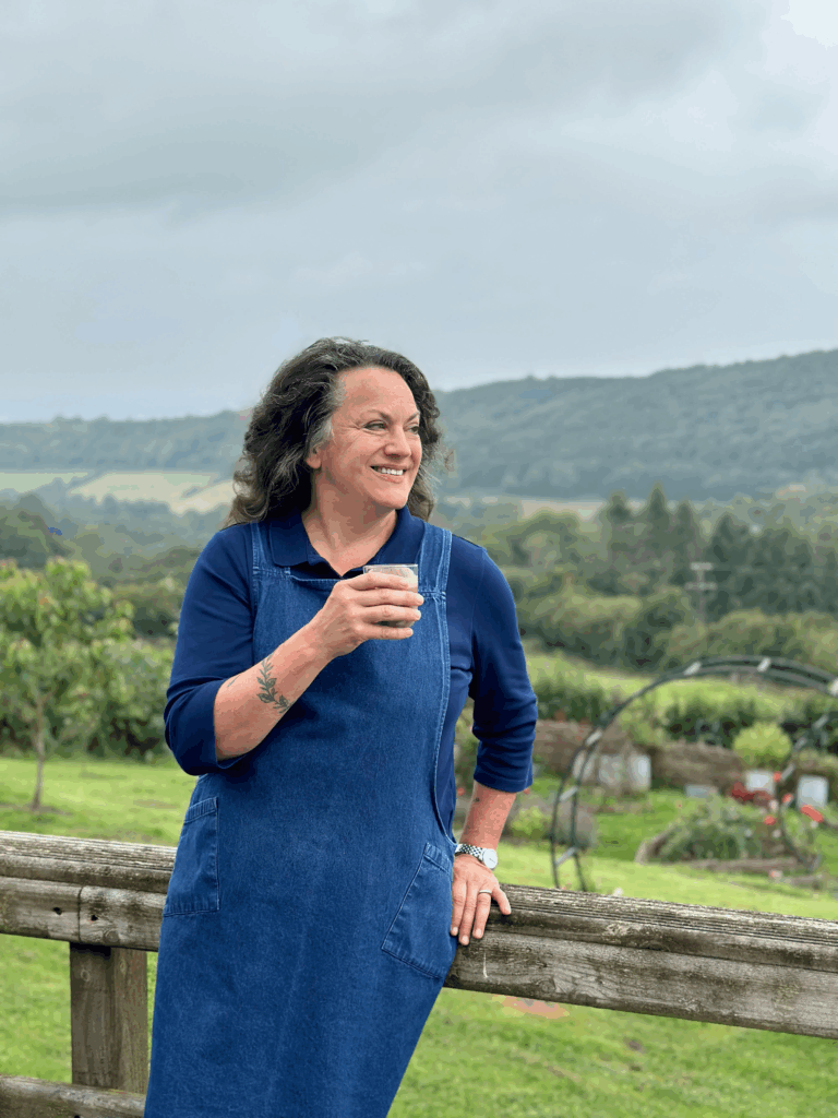 Image of Shann Jones drinking a Gut Health Protocol smoothie on the Chuckling Goat farm.