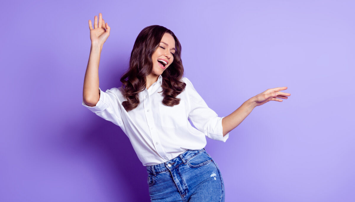 Photo of dreamy inspired lady dance open mouth close eyes wear white shirt isolated violet color background.