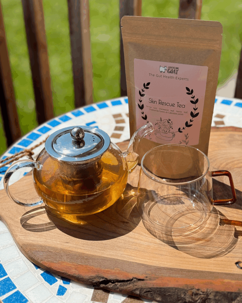 Image of Chuckling Goat Skin Rescue Tea and glass teapot.