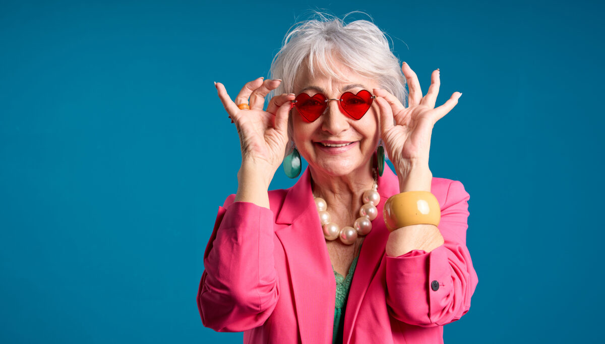 Fashionable Senior Woman with Heart-Shaped Sunglasses